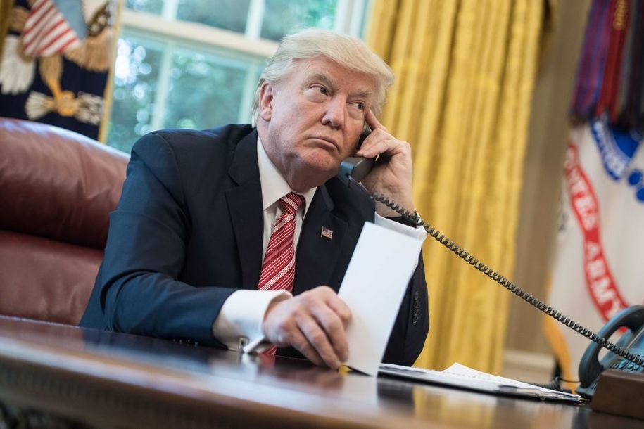 US President Donald Trump making a phone call.