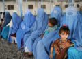 Women in Afghanistan wearing a blue burqa