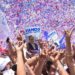 Vamos party supporters hold up posters of Alejandro Giammattei in Guatemala City on August 4