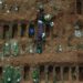 Aerial picture showing gravediggers burying an alleged COVID-19 victim at the Vila Formosa Cemetery, in the outskirts of Sao Paulo, Brazil. Photo: Nelson Almeida/AFP