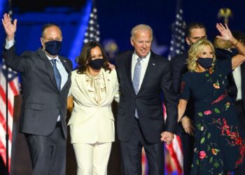 Joe Biden and Kamala Harris stand with their spouses Jill Biden and Doug Emhoff after delivering their victory speeches.